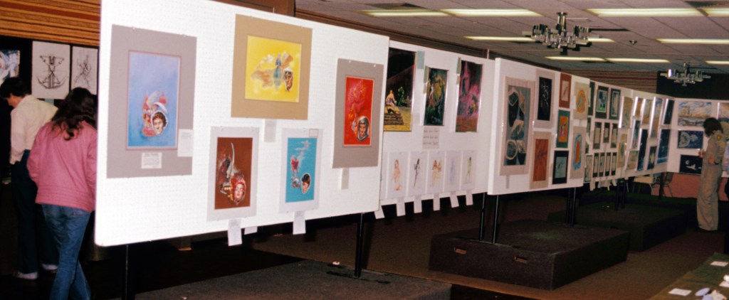 A long-shot of the art show room. 