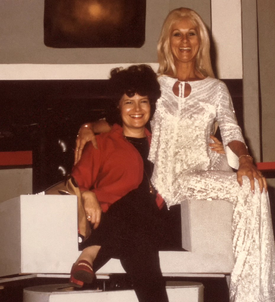 Author Joan Winston and Star Trek actor Grace Lee Whitney share the captain's chair at Toronto Star Trek '76