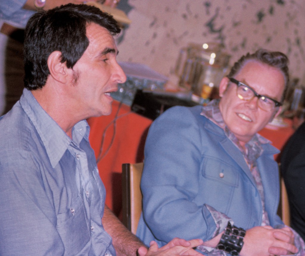 Star Trek actor Mark Lenard in a two-shot with artist Kelly Freas during a panel discussion. 
