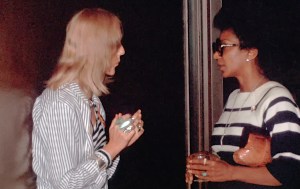 Star Trek actor Nichelle Nichols chats in a hall with Anne Passovoy. 