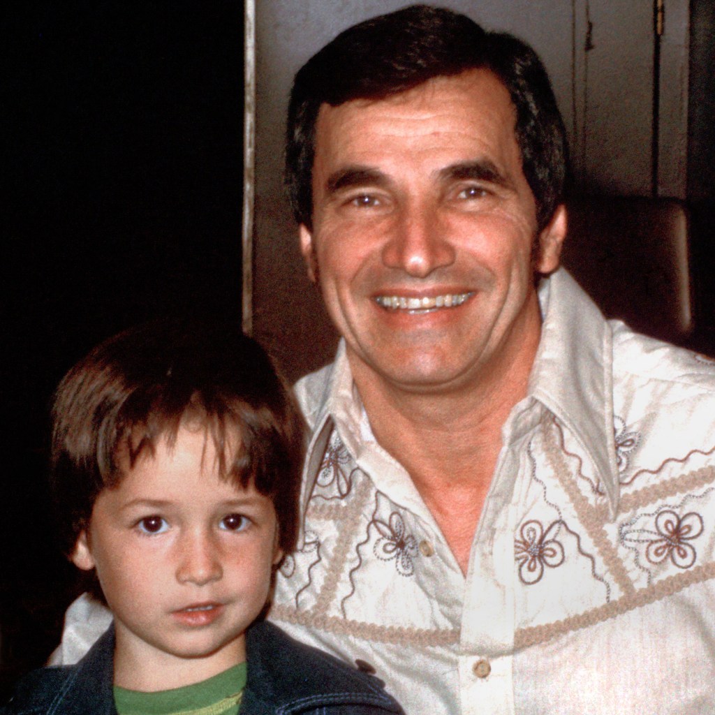 Star Trek actor Mark Lenard poses with a young boy, who appears to be about six years old. 