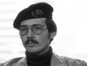 A black-and-white portrait of a young man, Hagglund, with a beret and moustache.